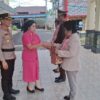 Polres Bitung Gelar Upacara Purna Bhakti, Lepas Dua Personel dengan Penuh Kehormatan