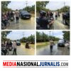 Banjir Rendam Jalan Sumor bor-Tanjung Selamat, Polsek Padang Tualang Sigap Atur Lalu Lintas