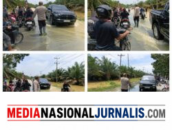 Banjir Rendam Jalan Sumor bor-Tanjung Selamat, Polsek Padang Tualang Sigap Atur Lalu Lintas
